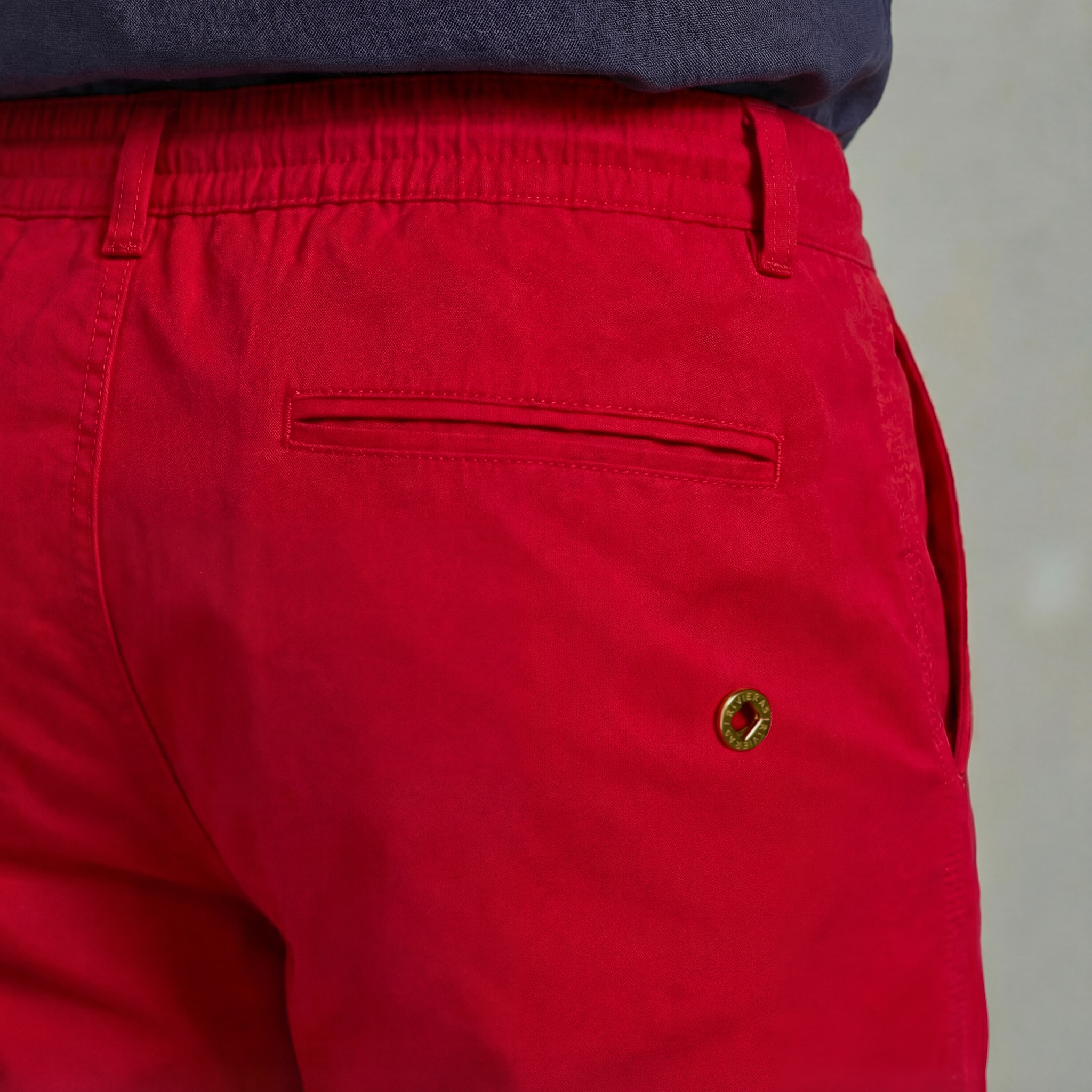 Red swimshorts with piped pocket