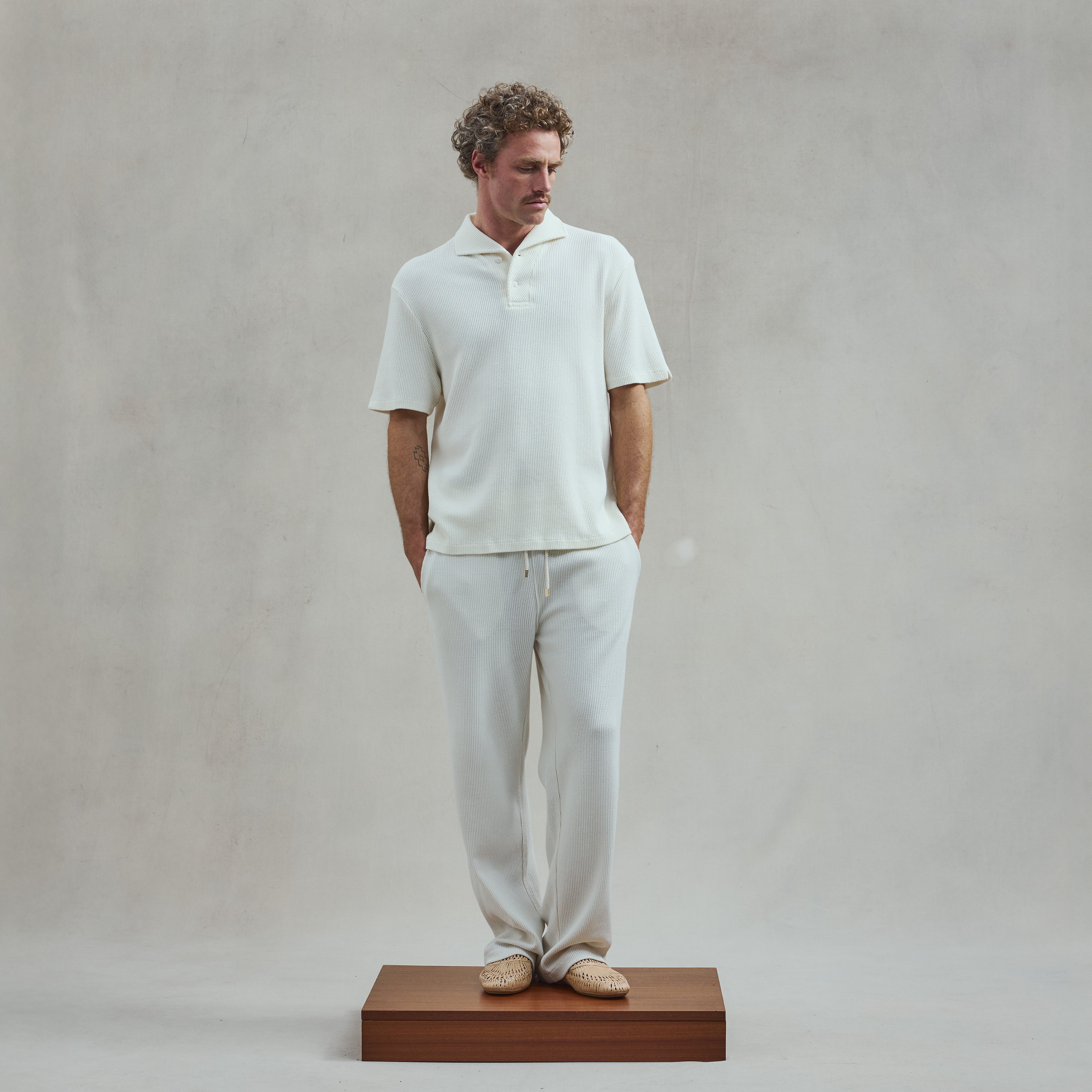 Polo col requin boutonné en interlock